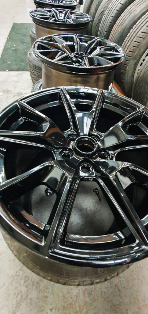 Alloy wheel with black powder coating