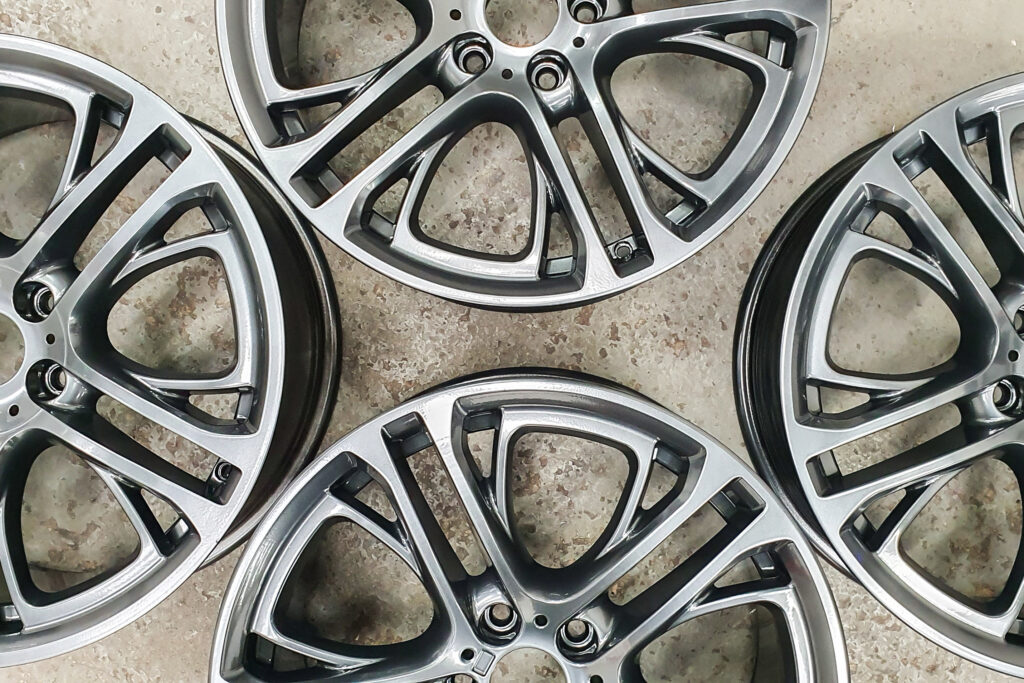 Collection of alloy wheels powder coated with a silver colour