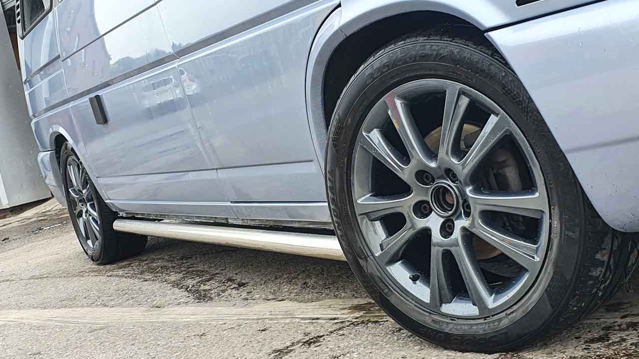 Gun metal powder-coated alloy wheels on a VW camper van