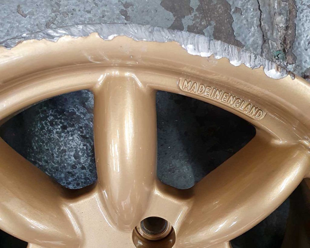 Kerb damage on an alloy wheel that is being refurbished at Manchester Powder Coating