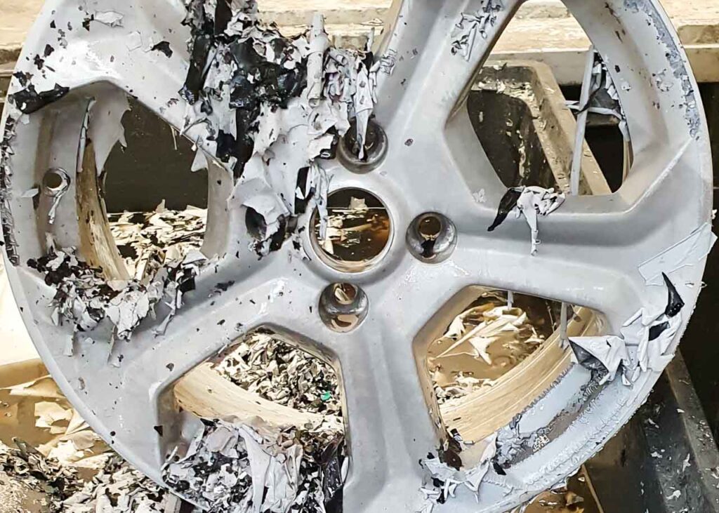Image of an alloy wheel after it has been stripped of paint.