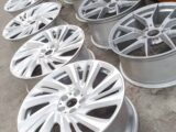Alloy wheels that have been acid dipped and ready for going gloss black powder coated